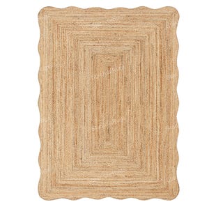 May include: Rectangular jute rug with a scalloped edge. The rug has a natural tan colour and a woven design. The interior has a series of concentric rectangles, creating a layered effect. Suitable for various interior decor styles.