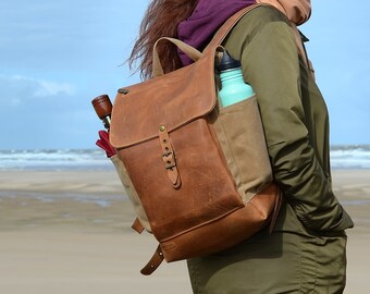 Waxed canvas and leather backpack with flap closure. Carry on travel rucksack. Laptop backpack.