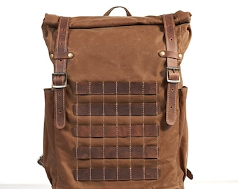 Travel waterproof rolltop backpack with a pals webbing and side pockets for bottle | Waxed canvas and crazy horse type leather.