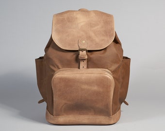 Waxed canvas drawstring backpack with leather flap and zip pocket. Personalized waterproof laptop backpack. Handcrafted brown canvas daypack