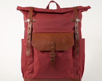 Red waxed canvas roll top backpack. Ready to ship.