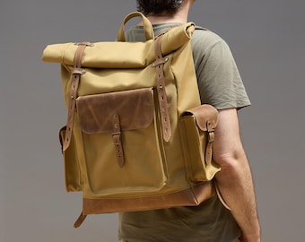 Dry waxed canvas travel roll top backpack. Personalized canvas and leather laptop rucksack. Custom daypack.