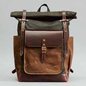 Handcrafted waxed canvas and leather roll top backpack. Customizable laptop backpack. Free personalization. Dark olive canvas daypack.