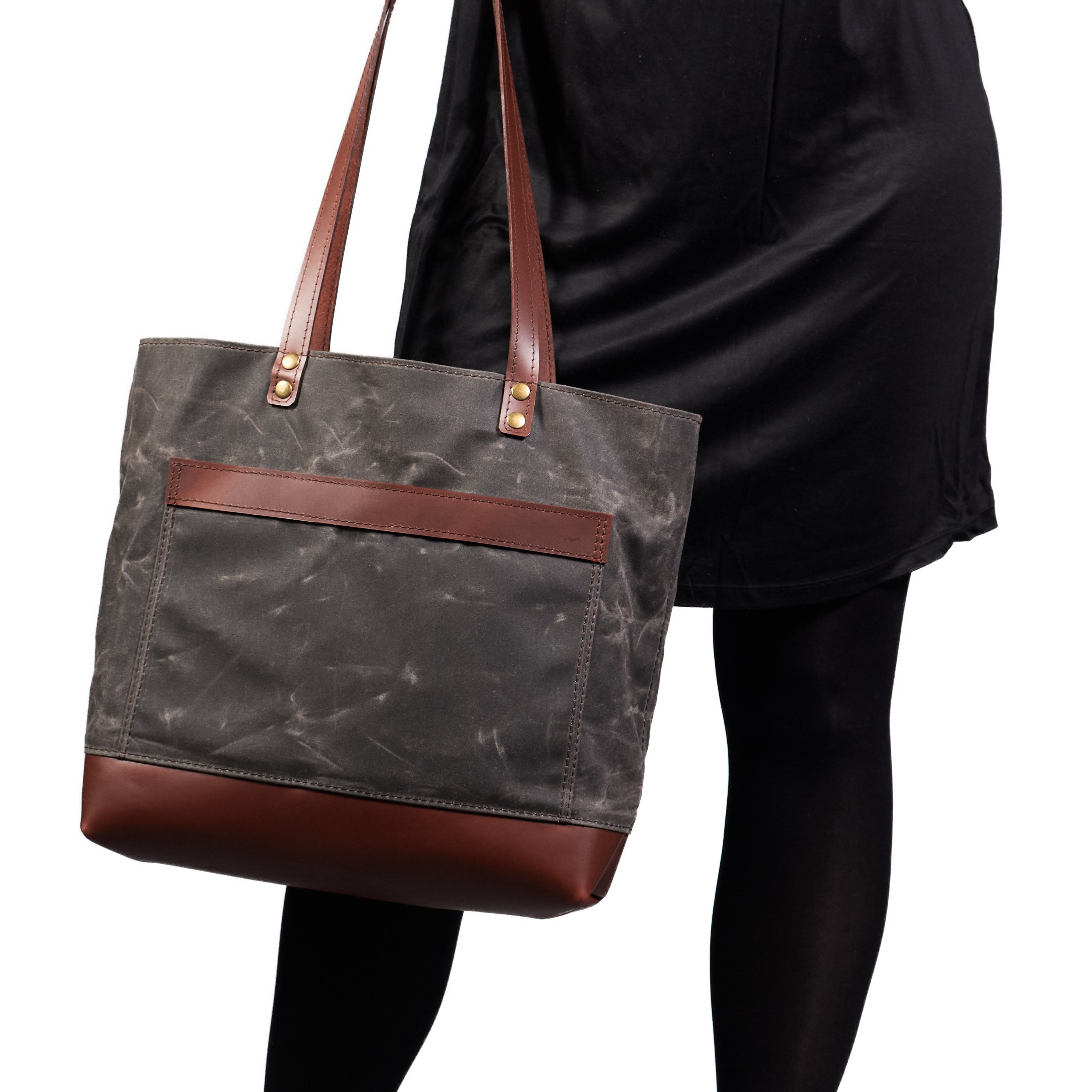 Waxed canvas tote bag with leather handles in dark brown