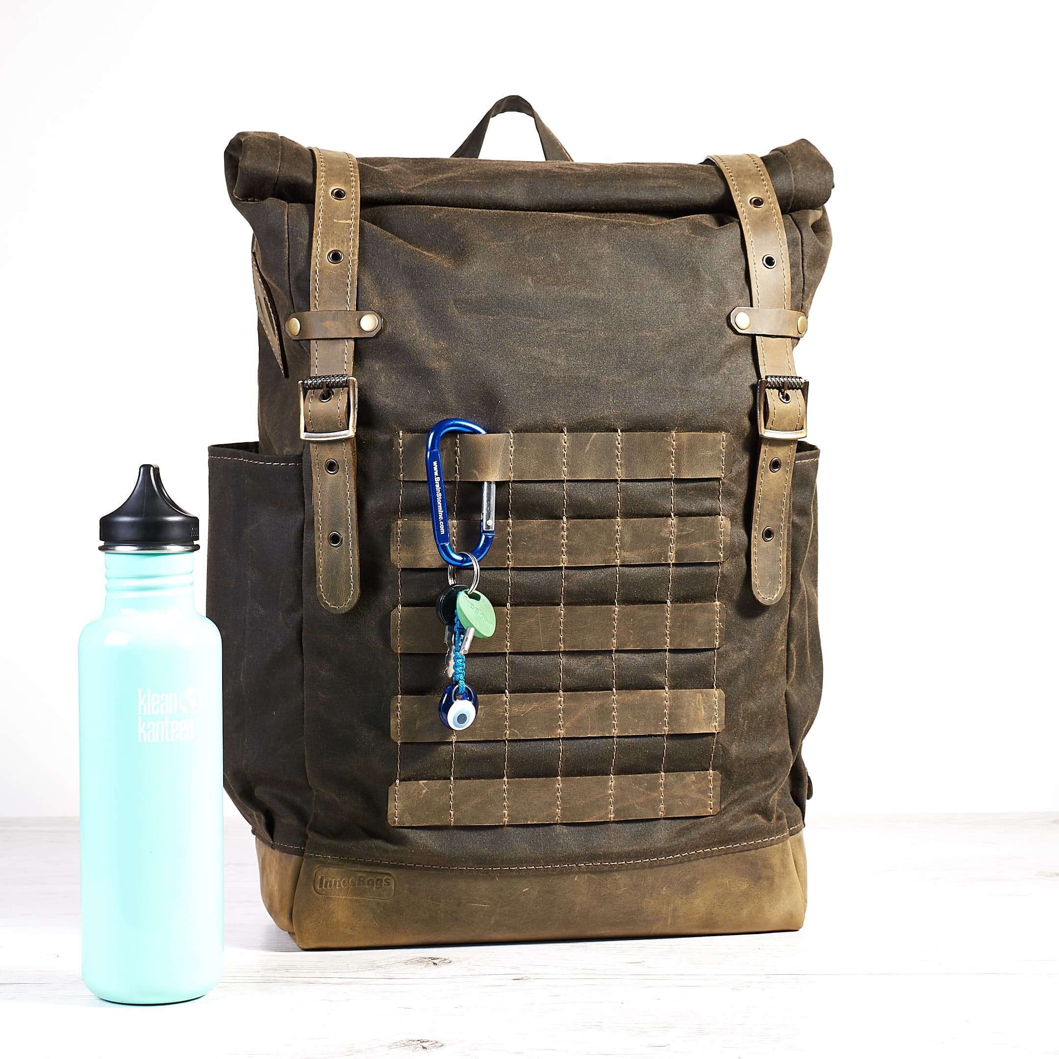 Dark olive waxed canvas leather backpack with molle grid. Travel backpack.