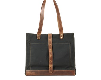 Waxed canvas tote bag in dark green timber. Leather handles, key chain
