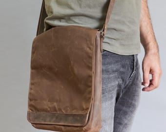 Brown waxed canvas tablet messenger bag. Small men's crossbody bag with leather strap. Water resistant vertical canvas and leather bag
