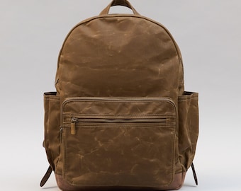 Waxed canvas leather laptop backpack with 2 zippered pockets. Urban, college, commuter backpack.