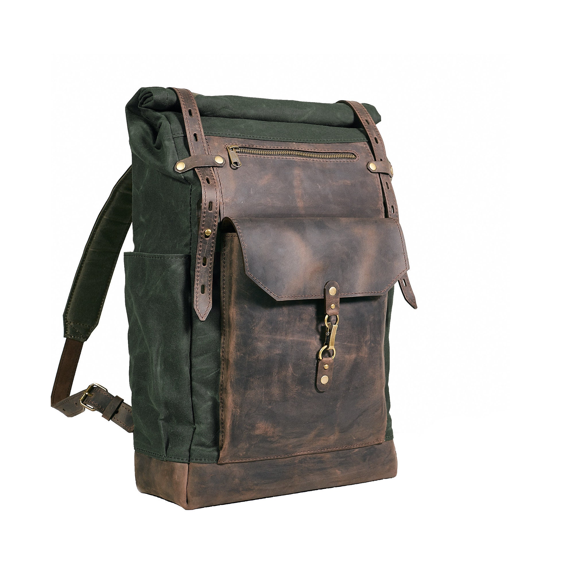 Waxed cotton roll-top rucksack. Hipster backpack in deep green color.