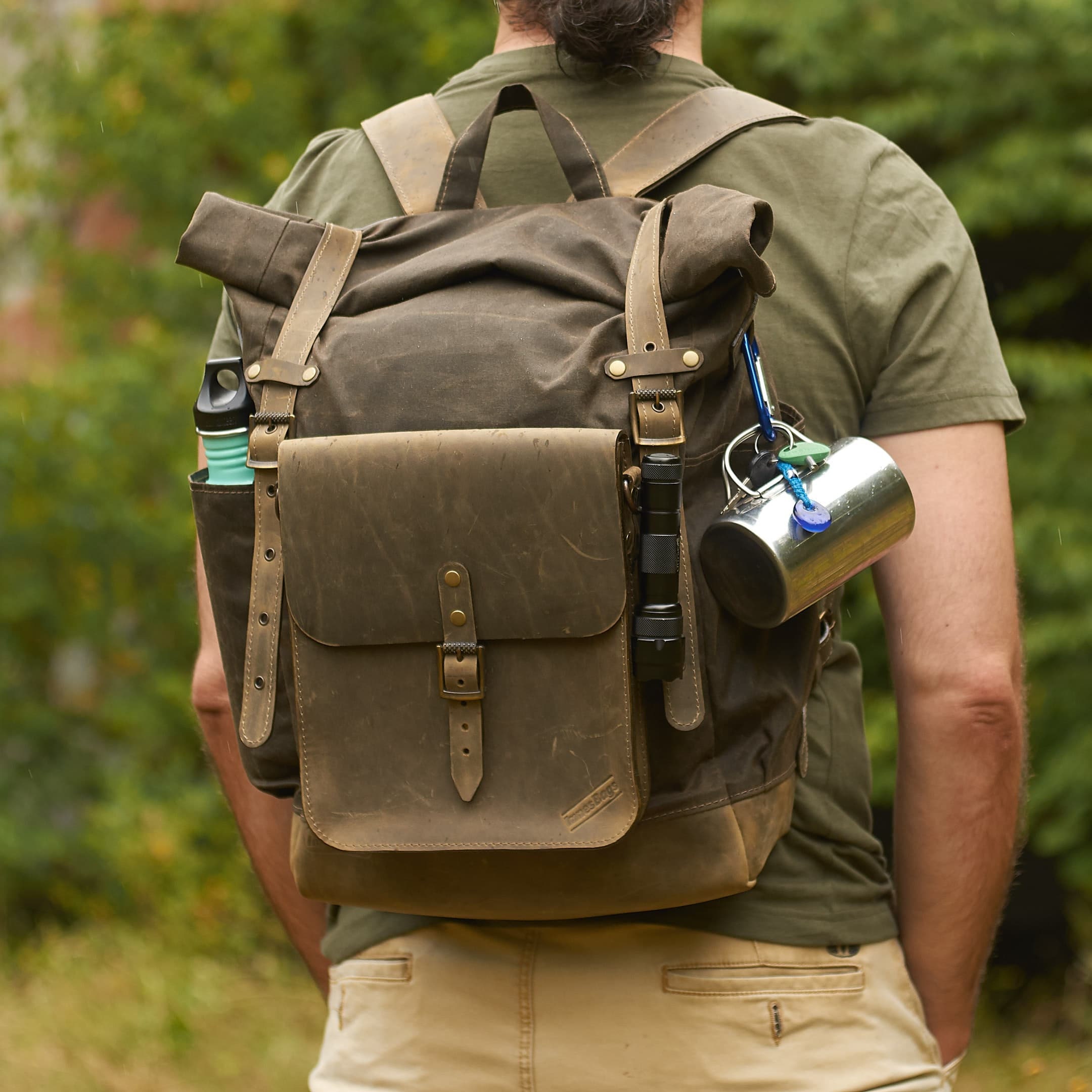 Olive waxed canvas leather backpack with molle grid. Leather crossbody bag.