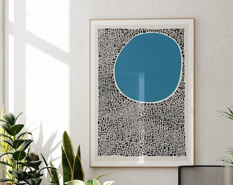May include: A framed rectangular wall art print featuring a large solid blue circle centered in the upper portion, set against a dense, intricate background of small, irregular black rectangular shapes on a white field, displayed in a room.