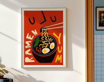 May include: A rectangular wall art print featuring a vibrant red background with a stylized illustration of a black ramen bowl. The bowl contains yellow noodles, two white eggs, and a shrimp. The text RAMEN YUM is printed in yellow letters.