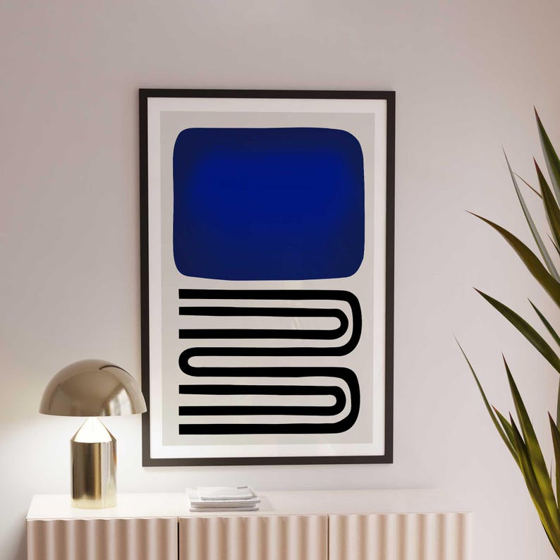 May include: A framed wall art print featuring a large solid dark blue rectangle positioned above a series of black horizontal lines that curve and connect in a continuous, stacked, U-shaped pattern against a light gray background.