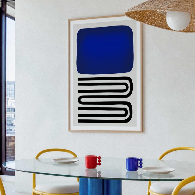May include: A framed wall art print featuring a large solid dark blue rectangle positioned above a series of black horizontal lines that curve and connect in a repeating U-shape pattern, all set against a light gray background.