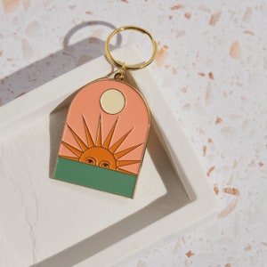 Setting Sun Enamel Keychain