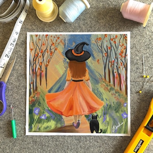 May include: An orange dress with a black witch hat and a black cat are featured in this painting. The artwork depicts a person walking down a path through a forest. The painting has a whimsical, autumnal theme. The artist's signature is in the bottom right corner.