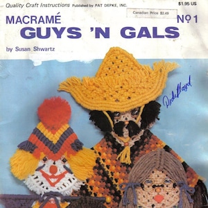 May include: A vintage macramé pattern book titled "Macramé Guys 'N Gals" by Susan Shwartz. The cover shows colourful macramé figures, including a clown, a figure with a hat, and two girls with glasses. The book is marked with a price.