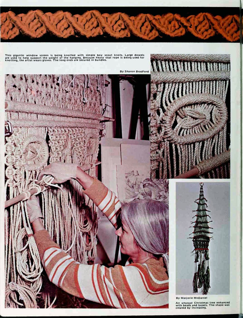 May include: A woman in a striped shirt is working on a large macrame wall hanging. The hanging is made of natural colored rope and is being created using simple knots. The rope is secured to dowels to help support the weight of the hanging.