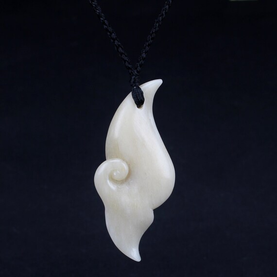 whale tail pendant meaning