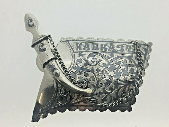 belt buckle dagger