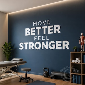 May include: A dark blue wall featuring the white text MOVE BETTER FEEL STRONGER. The room includes a physical therapy table, a rolling stool, a black kettlebell, a black exercise step, a wooden shelving unit, and an anatomical human model.