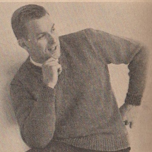 May include: A black and white photograph of a man wearing a dark grey sweater. He is looking to the side and has his hand on his chin.