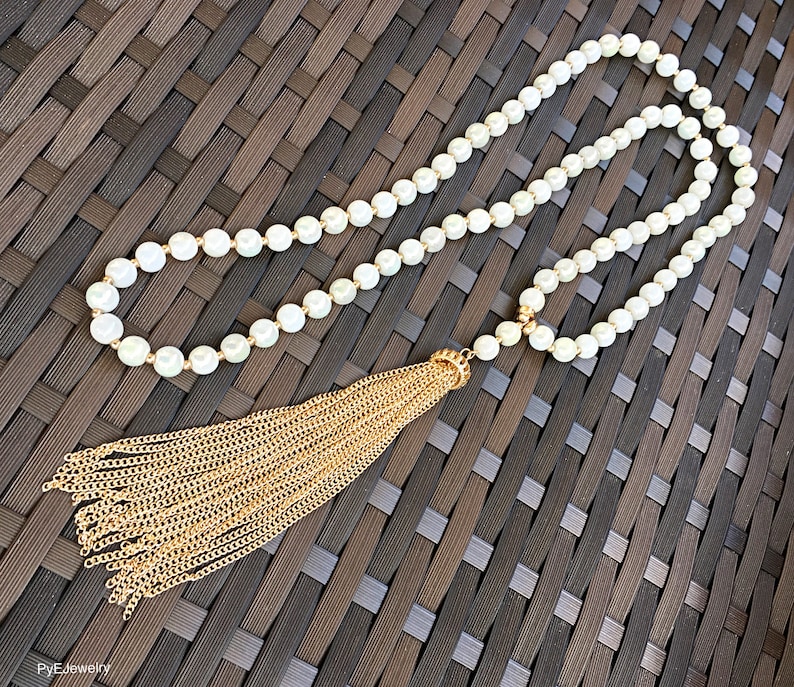 White and Gold Glass Beads Tassel Long Necklace White Gold Tassel Long Necklace.