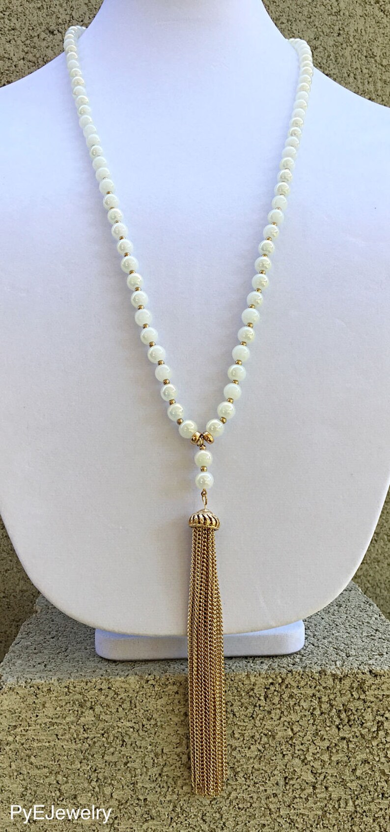 White and Gold Glass Beads Tassel Long Necklace White Gold Tassel Long Necklace.