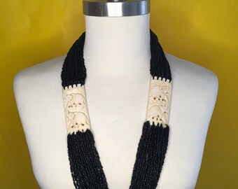 Black Multi Strand Seed Beads Long Necklace with White Elephants.