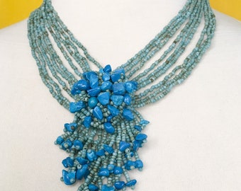 Teal Multi Strand Seed Beads Necklace with Blue Crystal Beads Medallion.