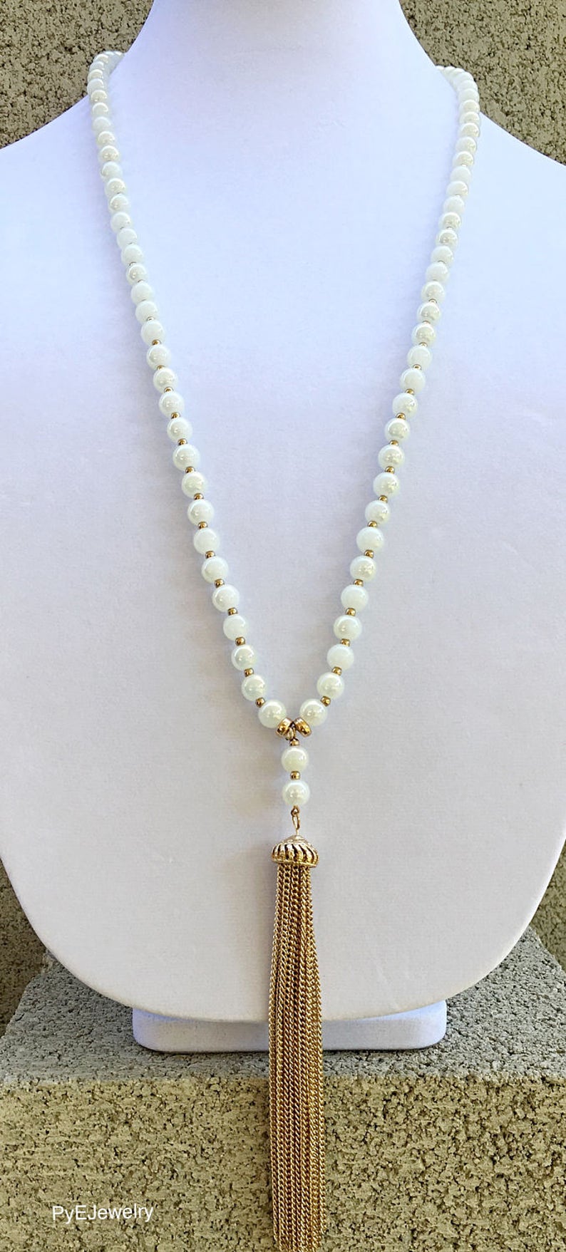 White and Gold Glass Beads Tassel Long Necklace White Gold Tassel Long Necklace.