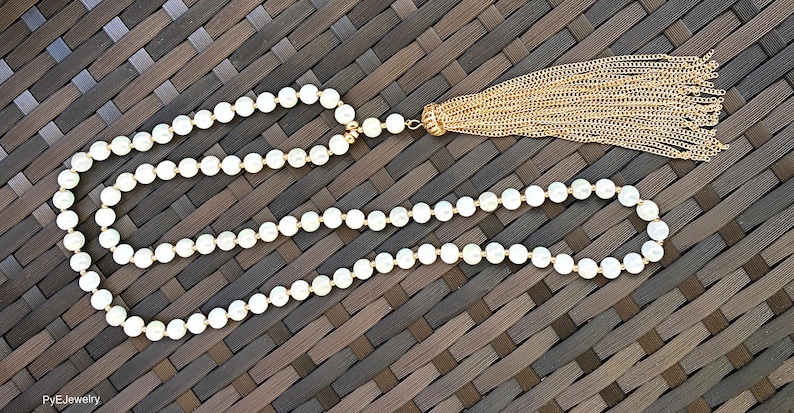 White and Gold Glass Beads Tassel Long Necklace White Gold Tassel Long Necklace.