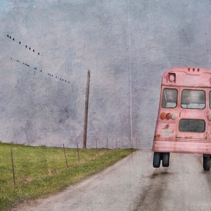 May include: A whimsical artwork depicts a pink school bus floating above a rural road. The bus, with visible wear, is set against a cloudy sky. A flock of birds flies overhead, adding to the dreamlike quality of the scene.