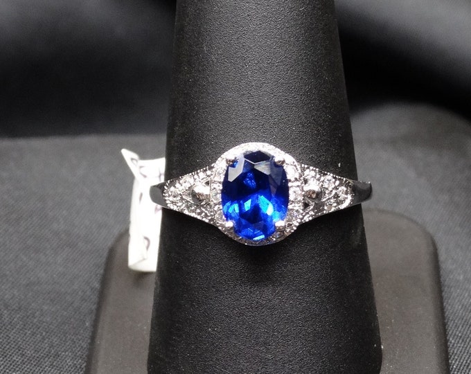 Oval Lab Sapphire with CZ Accents in Sterling Silver Ring