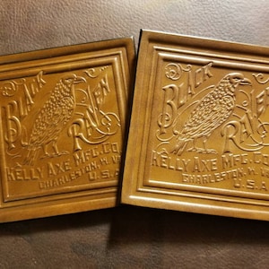 May include: Two brown leather patches with an embossed design of a black raven and the text "Black Raven Kelly Axe Mfg. Co. Charleston, WV U.S.A."