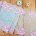 Mintgreen stretch lace with lightpink flowers - sold by the meter