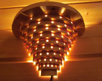 Wall lamp made of nordic pine rings  - wood lamp