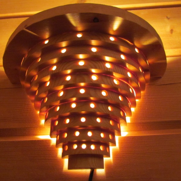 Wall lamp made of nordic pine rings  - wood lamp