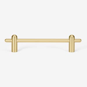 May include: A gold metal cabinet pull with rounded ends. The pull is about 6 inches long.