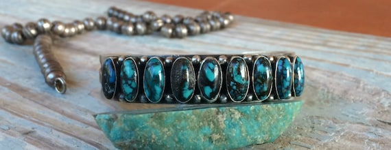 Signed Kirk Smith Sterling Silver Eight Stone Turquoise Row Cuff