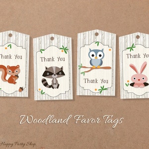 May include: Four woodland animal themed thank you tags. Each tag features a different animal: a squirrel, a raccoon, an owl, and a rabbit. The tags are printed on a white background with a woodgrain pattern and have a hole punched at the top for string or ribbon.