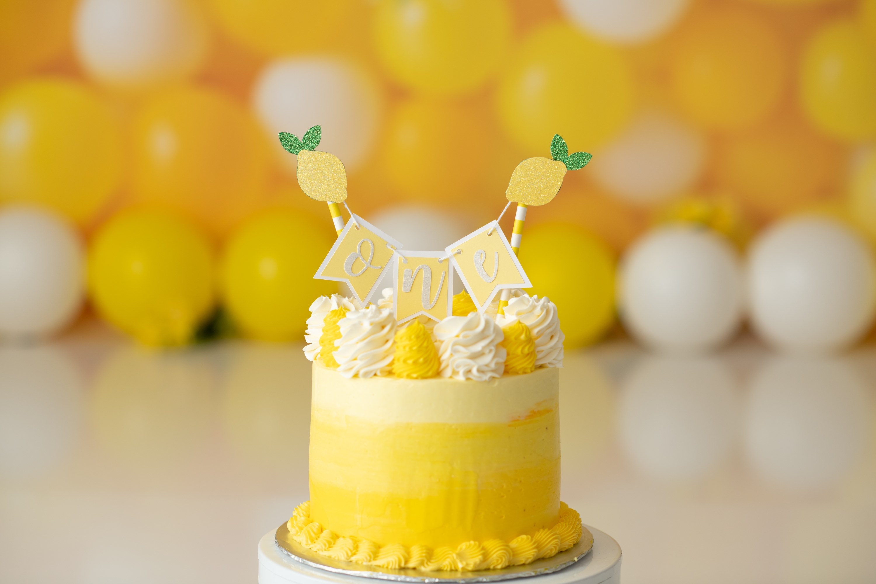 Sweet T's Bakeshop - We are in love with this Lemon 🍋 themed baby shower  cake! It's precious and perfect for summer sunshine ☀️. Hand painted top  tier! #lemon #babyshower #cakedecorating | Facebook