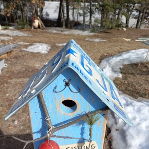 Image showcasing Handmade Fishing Birdhouse With Minnesota License Plate Roof - Etsy