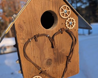 Montana license plate roof on barbed wire heart with gears bluebird big sky country