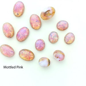 Oval shaped mottled cabochons in sizes 12x10 ,25x18 and 16x11.  Price is for 10 pieces