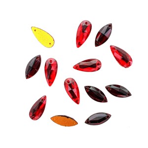 Sew on glass stones.  Very rare.  18x8mm in 2 shapes and colours.  Price is for 2 stones
