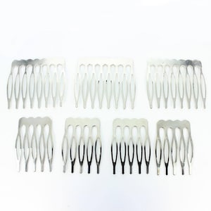 May include: Seven silver hair combs with a row of seven teeth each. The combs are small and delicate, perfect for holding hair in place.
