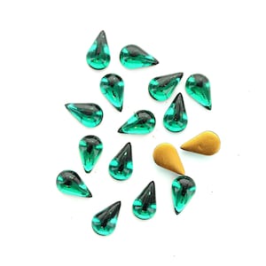 Swarovski pear shape 18x13 , 13x7.8  and 10x6 emerald  and jet cabochons.  Price is for 10 pieces and 5 pcs