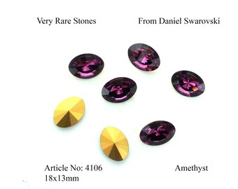May include: Six oval-shaped amethyst rhinestones and two gold-toned rhinestones. The amethyst rhinestones are 18mm x 13mm. The text "Very Rare Stones" and "From Daniel Swarovski" are at the top of the image. The text "Article No: 4106 18x13mm" is at the bottom left of the image. The text "Amethyst" is at the bottom right of the image.