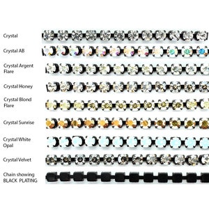 May include: A collection of nine horizontal rhinestone chains featuring black metal settings. The rows display various crystal colours including clear, iridescent AB, silver, honey, blonde, sunrise, white opal, and velvet, with a final black chain.